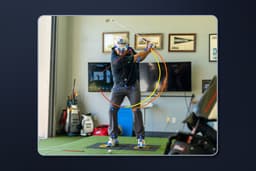 Golfer in studio on sensor plates showing center of mass tracking, with background.jpg