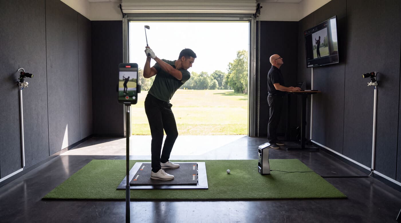 Swing catalyst coaching studio setup with multiple cameras including iPhone